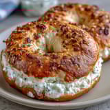 Soft, homemade bagels made with Greek yogurt, topped with a savory blend of sesame, poppy, garlic, and onion.  
