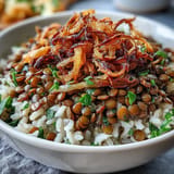 Levantine Mujadara: fluffy rice, tender lentils, crowned with crispy fried onions.