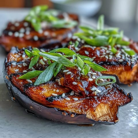 Golden Miso Glazed Eggplant served warm as a vegan side dish, perfect alongside steamed rice for an umami-rich meal.  