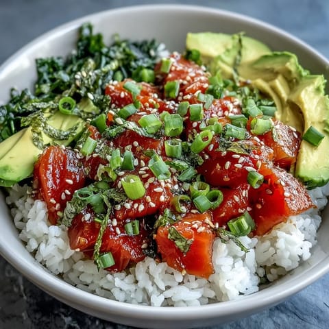 Vibrant Salmon Poke Bowl with creamy avocado and edamame toppings.