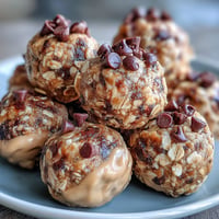 Golden snack-sized protein balls with peanut butter and oats, bite-sized energy.